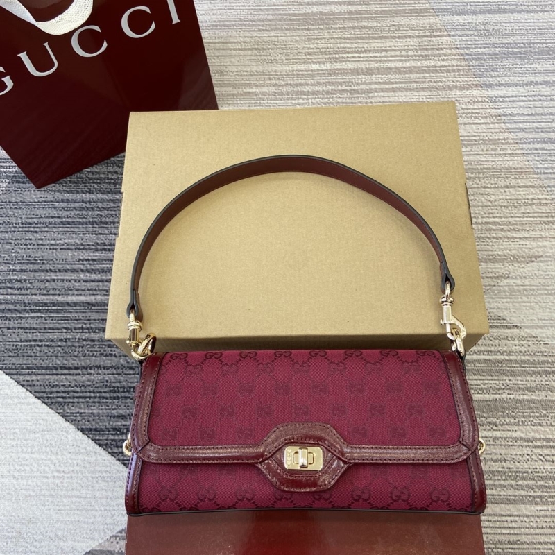 G*u*i top handle bags